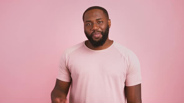 Studio Portrait of Happy African American Bearded Man Showing Ok Gesture and Smiling Pink Background