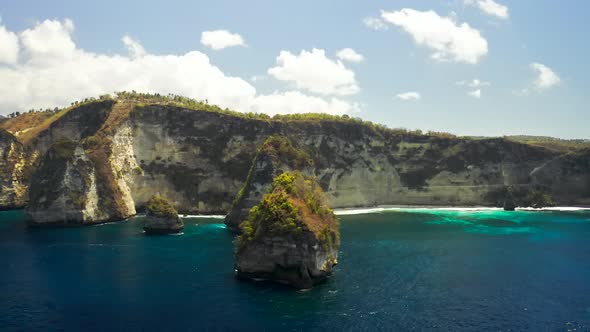 Rocks and Cliffs in the Ocean at Diamond Beach in Nusa Penida Island, Bali in Indonesia. Aerial View