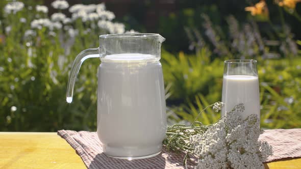Milk and flowers on the table