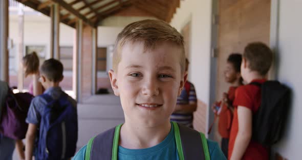 Boy smiling in the school corridor