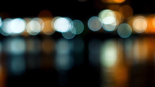 Street Lights Reflect in Water at Harbor