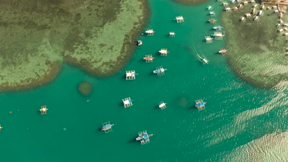 Tourist Boats in a Bay with Blue Water