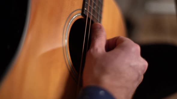 Closeup Hands of Unrecognizable Guitarist Man Playing on Acoustic Guitar at Home Recording Studio