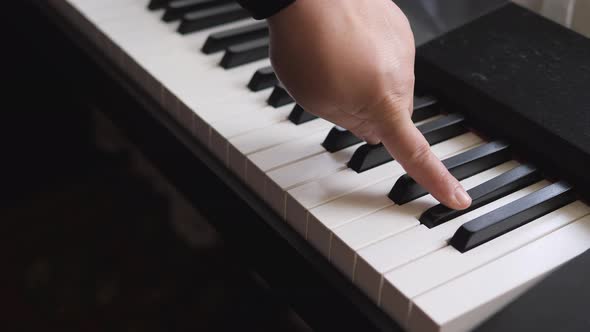 Electronic Piano. Fingers Press the Piano Keys. Music Lesson.