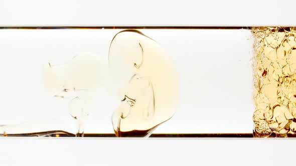 Macro Shot of Yellow Air Bubbles on White Background alt