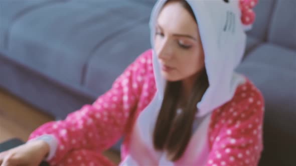 Young Woman in Funny Pajama Working From Home