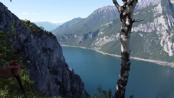 Hiker walking at viewpoint, Lake Como, Lombardy, Italy