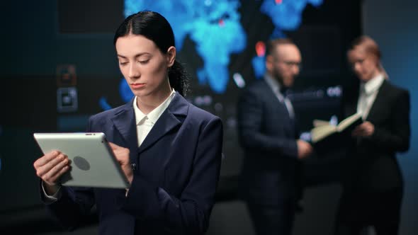 Focused Asian Woman in Suit Working on Tablet Pc Use Digital Technology