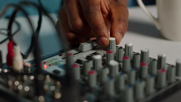 Close Up of Person Using Podcast Equipment Board for Video