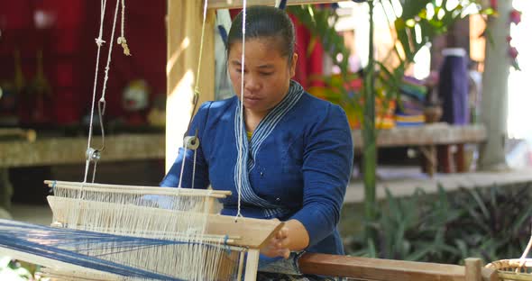 Woman Weaving Silk