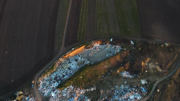 Aerial Drone View of Large Garbage Landfill Near Agricultural Land