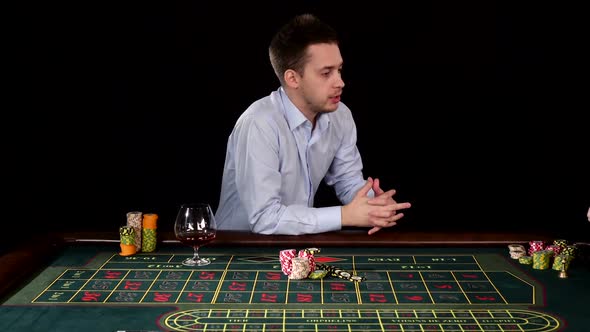 Excitable Guy Playing Poker. Black