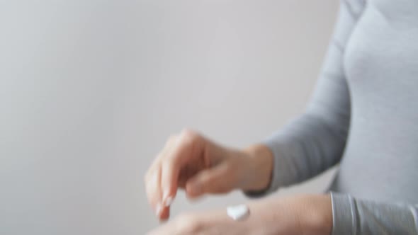 Close Up of Woman Applying Moisturizing Hand Cream