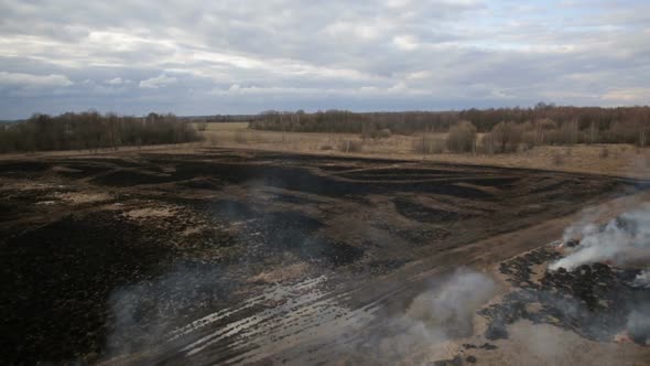 Aerial View of Dry Grass Burning on the Farmland