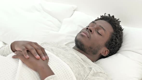 African Man Having Neck Pain in Bed