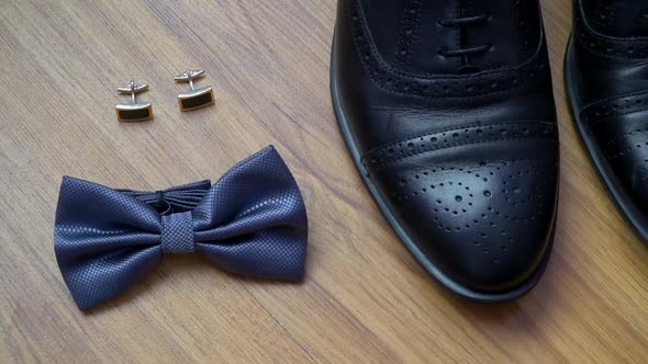 Men's Accessories on a Wooden Background. Shoes, Cufflinks, Bowtie