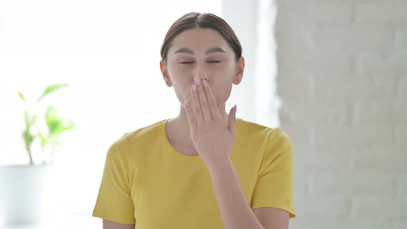 Portrait of Woman Giving Flying Kiss by Hands