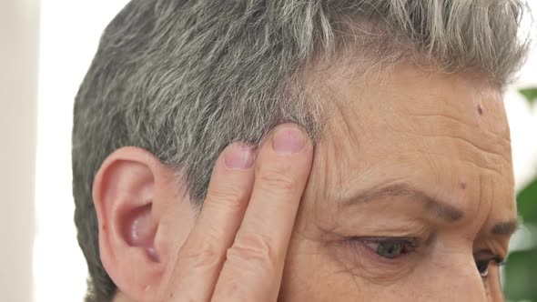 Face of Senior Woman Suffering From Headache