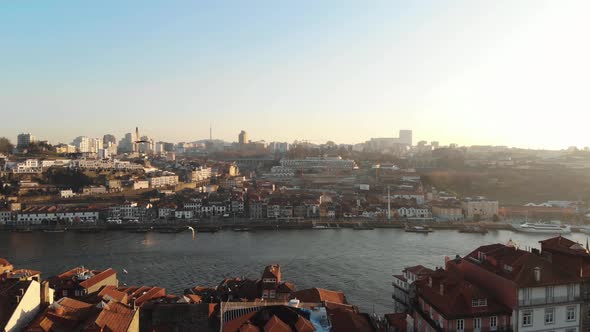 Fly over Ribeira and view of Vila Nova de Gaia with the famous Porto wine cellars