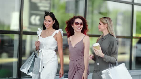 Group of Attractive Young Gossip Girl Friend Enjoying Weekend Having Shopping Bag