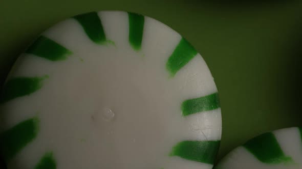 Rotating shot of spearmint hard candies - CANDY SPEARMINT 026