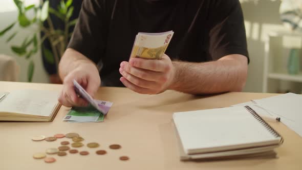 Man Counting Money for Monthly Expenses Rich Person Holding a Stack of Euro in Hands