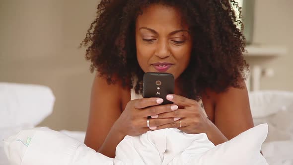 Woman video chatting using smartphone