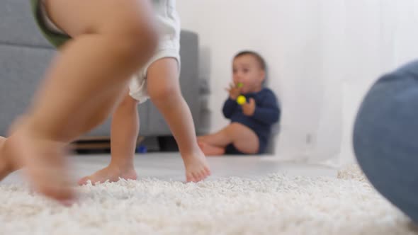 Unrecognizable Toddler Learning to Walk and Falling