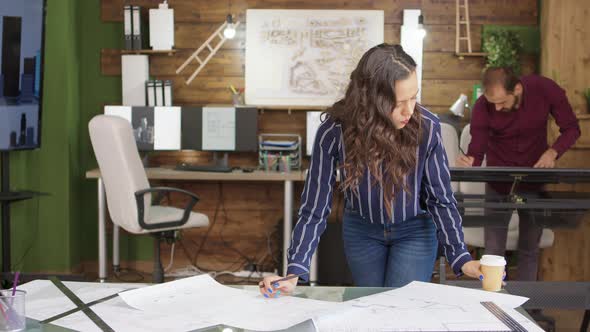 Female Construction Engineer Taking a Sip of Coffee