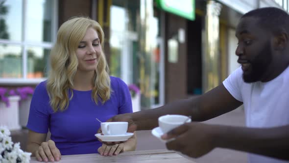 People Drinking Coffee in Outdoor Cafe, Romantic Date of Happy Mixed Race Couple