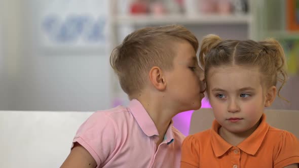 Boy Whispering to Girl, Telling Lies to Innocent Small Sister, Brother Pranking