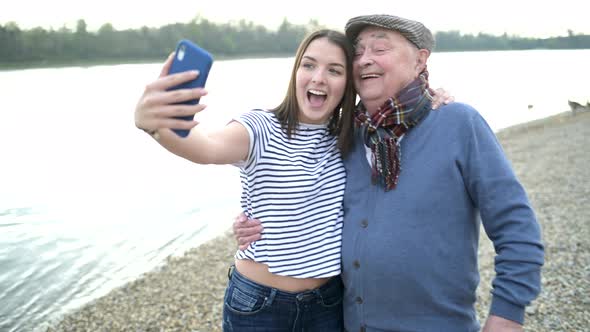 Senior enjoying time with his granddaughter during a walk