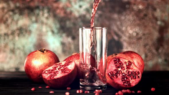 Superm Slow Motion Pomegranate Juice Poured Into the Glass