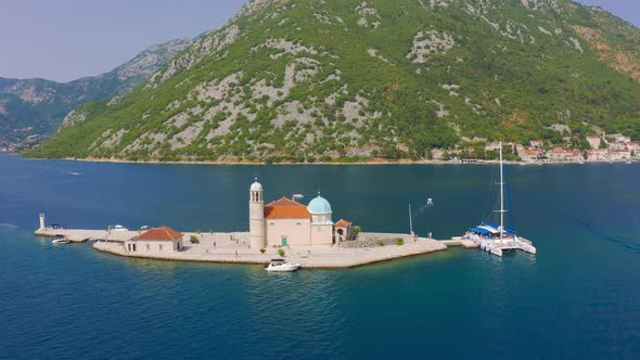 Aerial View Drone Around a Saint George Island and Church of Our Lady of the Rocks in Perast