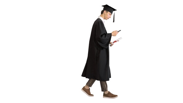 Graduation: Happy Student Walking and Texting on His Phone