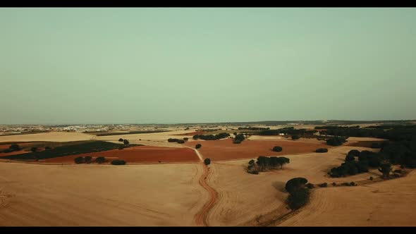 Aerial fly view of arid country side. Drone above flight landscape of rural area. Climate change