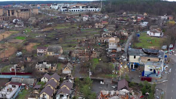 Aerial view of the destroyed and burnt houses. alt