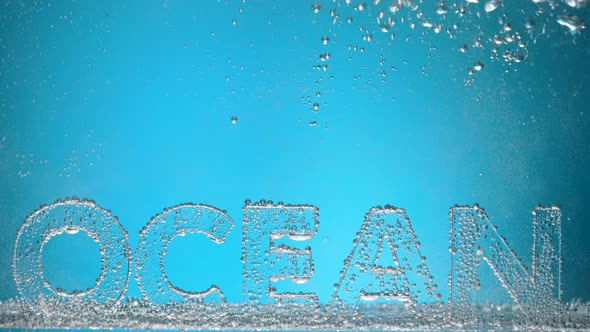 Word Ocean Underwater in Oxygen Bubbles on Blue Background