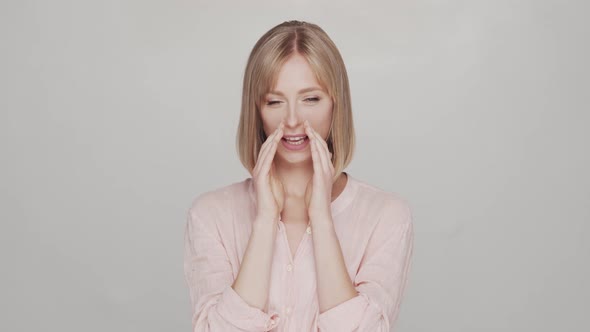 Studio portrait of young, beautiful and natural blond woman.