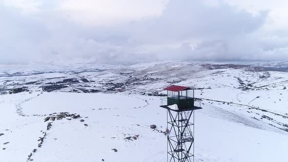 Watchtower on Mountain Snow