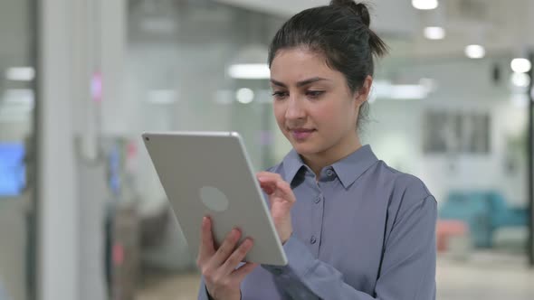 Portrait of Young Indian Woman Using Digital Tablet