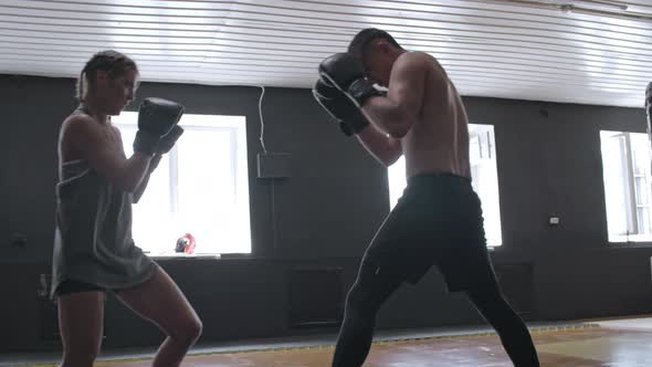 Man and Woman Having Boxing Fight alt