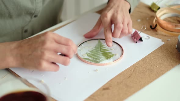 Woman Fixes Glass Plates