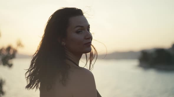 Closeup of a Girl at Sunset By the Sea