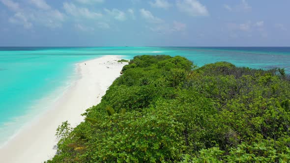 Wide fly over travel shot of a paradise sunny white sand beach and blue sea background in high resol