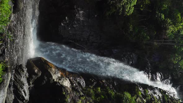 Beautiful scene of Ta Gu waterfall on sunny day. Vertical, static