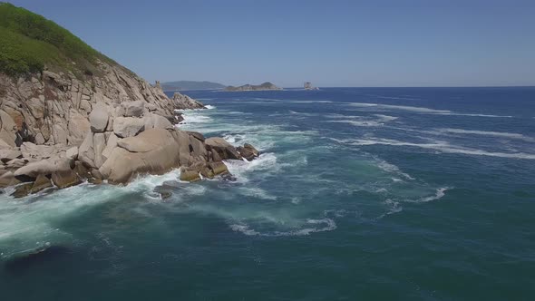 View From a Droneon a Stone Cape Washed By Strong Waves