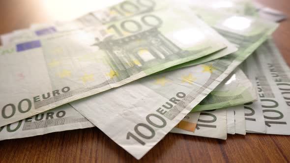 Euro Money Banknotes. Hands counting Euros bills as part of the united country's payment system.