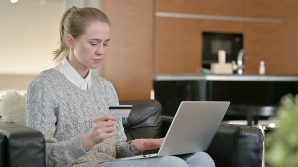 Young Woman Making Successful Online Payment on Laptop 