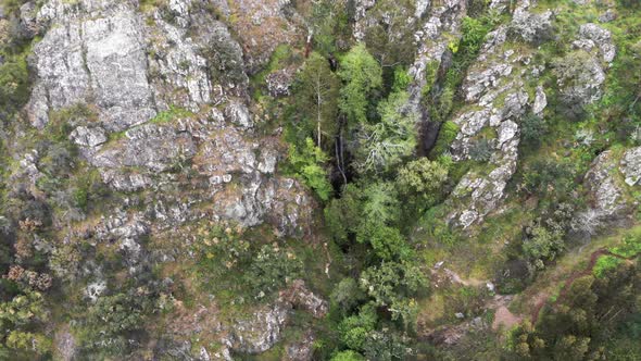 Bird's-eye view of barbelote waterfall, Monchique, Algarve. Amazing forest and cliffs.